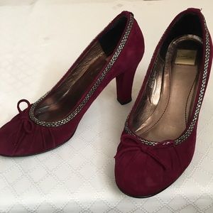 Burgundy suede Coach heels.